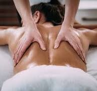 Person receiving a back massage with hands applied on their skin, Massage Springhouse